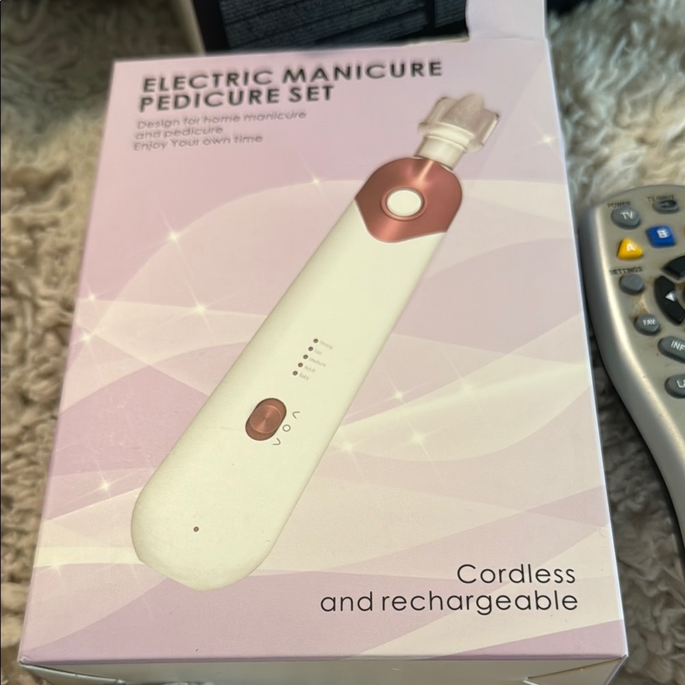 Cordless White and Pink Nail Care Tool